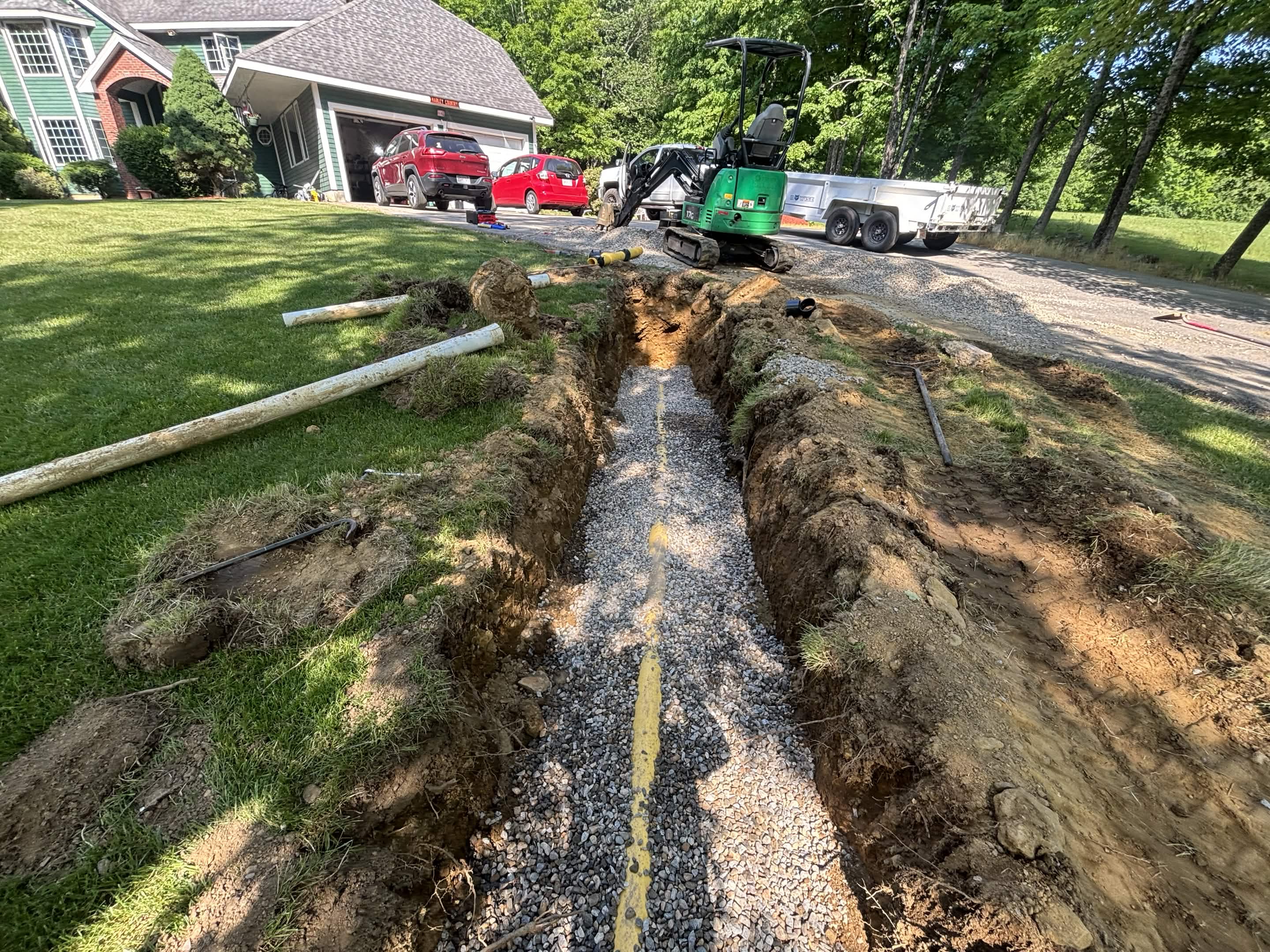 Pipe outlet complete — collector pipe running to pond